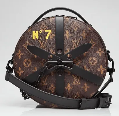 Round Louis Vuitton monogram canvas bag with “N°7” in yellow and black leather hardware
